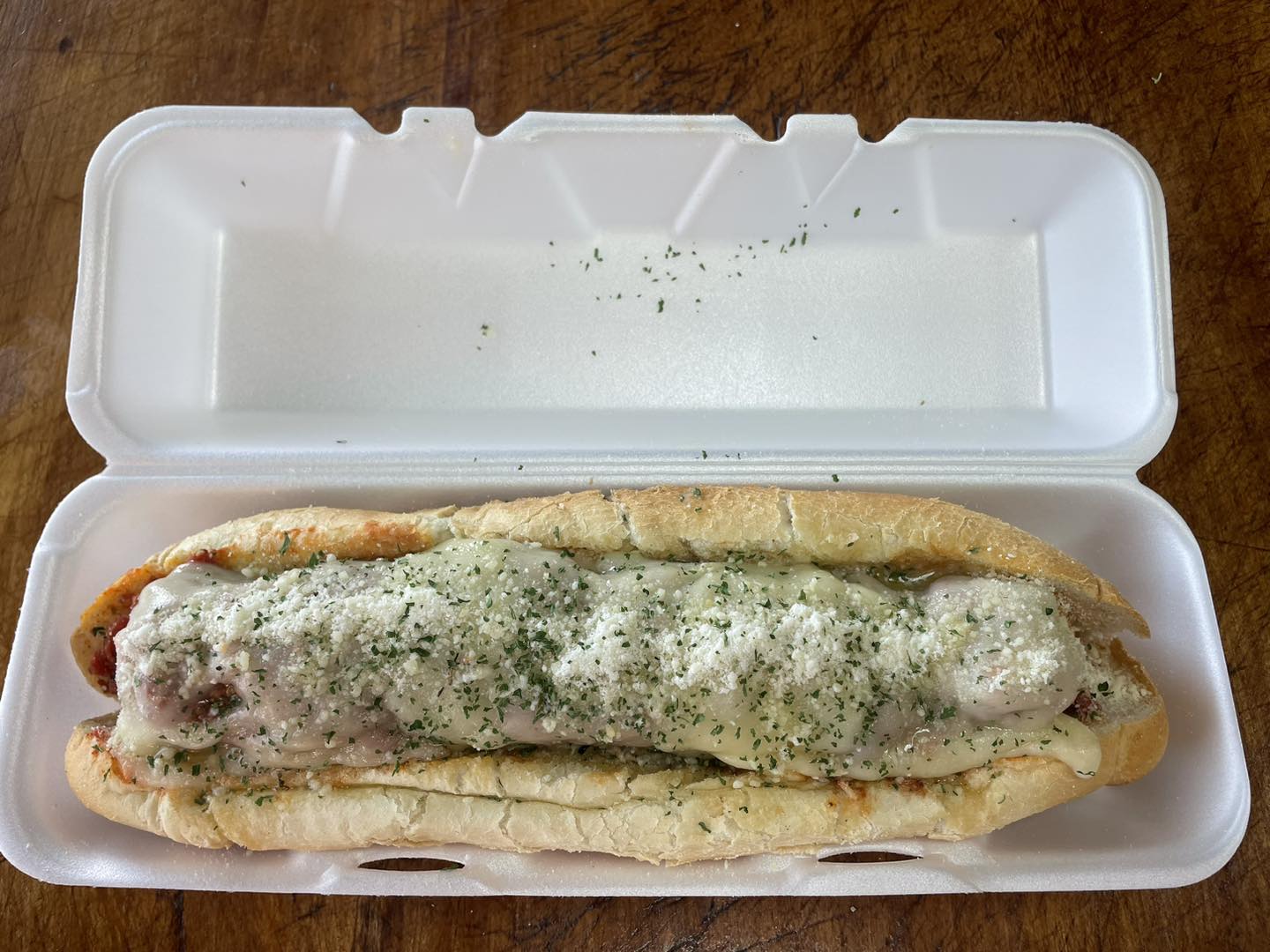 Cheese-smothered sub on an Amoroso roll